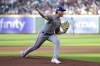 Texas Rangers starting pitcher Jon Gray throws to a Houston Astros batter during the first inning of a baseball game Saturday, April 15, 2023, in Houston. (AP Photo/Michael Wyke)