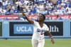 Ayo Robinson, daughter of Los Angeles Dodgers great Jackie Robinson, throws out the ceremonial first pitch prior to a baseball game between the Dodgers and the Chicago Cubs Saturday, April 15, 2023, in Los Angeles. (AP Photo/Mark J. Terrill)