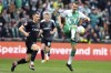 Bremen's Christian Gross, left, and Freiburg's Maximilian Eggestein, left, challenge for the ball during the German Bundesliga soccer match between SV Werder Bremen and SC Freiburg in Bremen, Germany, Sunday, April 16, 2023. (Carmen Jaspersen/dpa via AP)