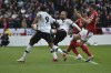 Manchester United's Christian Eriksen, centre, makes an attempt to score during the English Premier League soccer match between Nottingham Forest and Manchester United at City ground in Nottingham, England, Sunday, April 16, 2023. (AP Photo/Rui Vieira)