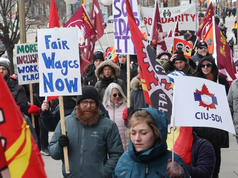 Members of the Public Service Alliance of Canada (PSAC) demonstrate outside the Treasury Board building in Ottawa on Friday, March 31, 2023. Canada's largest federal public service union is expected to announce the next steps in the drawn out contract negotiations with the government, after members voted for a mandate to launch the largest strike against a single employer in Canada's history. THE CANADIAN PRESS/ Patrick Doyle