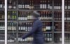 Manitoba's plan to expand private liquor sales may not happen before the provincial election slated for Oct. 3. A person walks past shelves of bottles of alcohol on display at an outlet in Ottawa on Thursday, March 19, 2020. THE CANADIAN PRESS/Adrian Wyld
