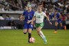 United States' Julie Ertz (8) and Ireland's Denise O'Sullivan (10) battle for the ball during the second half of an international friendly soccer match Tuesday, April 11, 2023, in St. Louis. (AP Photo/Jeff Roberson)