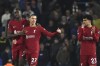 Liverpool's Darwin Nunez, centre, celebrates after scoring his side's sixth goal during the English Premier League soccer match between Leeds United and Liverpool at Elland Road in Leeds, England, Monday, April 17, 2023. (AP Photo/Rui Vieira)