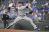 Texas Rangers starting pitcher Jacob deGrom throws to a Kansas City Royals batter during the first inning of a baseball game, Monday, April 17, 2023, in Kansas City, Mo. (AP Photo/Reed Hoffmann)