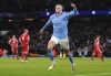 Manchester City's Erling Haaland celebrates after scoring his side's third goal during the Champions League quarterfinal, first leg, soccer match between Manchester City and Bayern Munich at the Etihad stadium in Manchester, England, Tuesday, April 11, 2023. (Tim Goode/PA via AP)