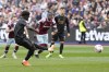 Arsenal's Bukayo Saka fails to score from penalty kick during the English Premier League soccer match between West Ham United and Arsenal at the London stadium in London, Sunday, April 16, 2023. (AP Photo/Kirsty Wigglesworth)