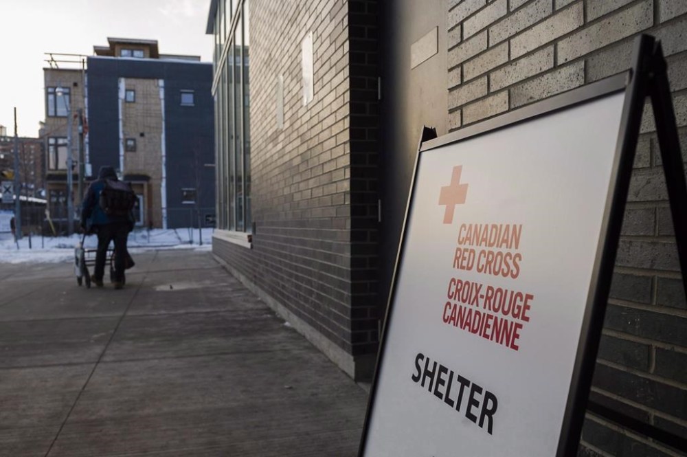 Toronto's warming centres would open to people in need of shelter when temperatures drop to -5C next winter season under proposed changes detailed in a city staff report. The Regent Park Community Centre in Toronto was functioning as a warming centre on Friday, January 5, 2018. THE CANADIAN PRESS/Christopher Katsarov