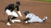 Chicago White Sox's Tim Anderson, right, slides safely into second with a stolen base ahead of a tag-attempt by Pittsburgh Pirates second baseman Rodolfo Castro (14) during the seventh inning of a baseball game in Pittsburgh, Saturday, April 8, 2023. (AP Photo/Gene J. Puskar)