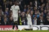 Real Madrid's Rodrygo, right, celebrates after scoring the opening goal as Vinicius Junior walks during the Champions League quarterfinal second leg soccer match between Chelsea and Real Madrid at Stamford Bridge stadium in London, Tuesday, April 18, 2023. (AP Photo/Kirsty Wigglesworth)