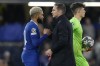 Chelsea's interim head coach Frank Lampard, centre, and Chelsea's Reece James shake hands after the Champions League quarterfinal second leg soccer match between Chelsea and Real Madrid at Stamford Bridge stadium in London, Tuesday, April 18, 2023. (AP Photo/Kirsty Wigglesworth)