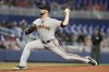 San Francisco Giants' Alex Wood throws during the first inning of a baseball game against the Miami Marlins, Tuesday, April 18, 2023, in Miami. (AP Photo/Lynne Sladky)