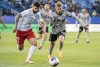 CF Montreal's Bryce Duke (10) challenges Vaughan SC's Chris Mannella during first half preliminary round Canadian Championship soccer action in Montreal, Tuesday, April 18, 2023. THE CANADIAN PRESS/Graham Hughes