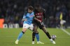 Napoli's Giovanni Di Lorenzo, left, fights for the ball with AC Milan's Rafael Leao during a Champions League quarterfinal second leg soccer match between Napoli and AC Milan, at Naples' Diego Armando Maradona stadium, Tuesday, April 18, 2023. (AP Photo/Andrew Medichini)