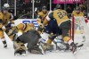 Vegas Golden Knights goaltender Laurent Brossoit (39) grabs the puck against the Winnipeg Jets during the first period of Game 1 of an NHL hockey Stanley Cup first-round playoff series Tuesday, April 18, 2023, in Las Vegas. (AP Photo/John Locher)