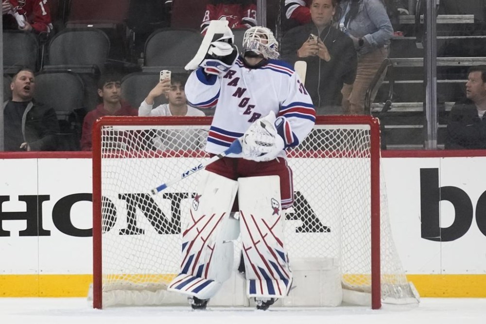 New York Rangers goaltender Igor Shesterkin points upward at the end of the third period of Game 1 of an NHL hockey Stanley Cup first-round playoff series against the New Jersey Devils in Newark, N.J., Tuesday, April 18, 2023. The Rangers defeated the Devils 5-1. (AP Photo/Seth Wenig)