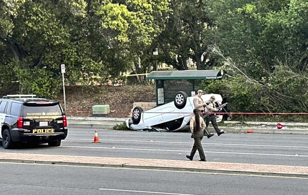 Ventura County law enforcement investigate the scene where a teenager was killed and three others injured after a stabbing suspect crashed his vehicle into the group as they were walking near their high school, in Thousand Oaks, Calif., Tuesday, April 18, 2023. (Juan Carlo/Ventura County Star via AP)