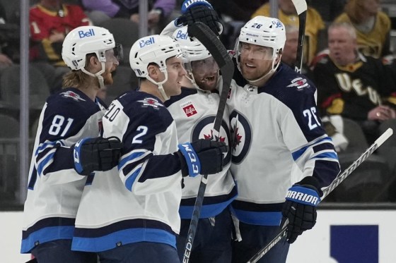 Winnipeg Jets celebrate after left wing Kyle Connor, second from right, scored against the Vegas Golden Knights in Game 1 on Tuesday. (John Locher / The Associated Press files)