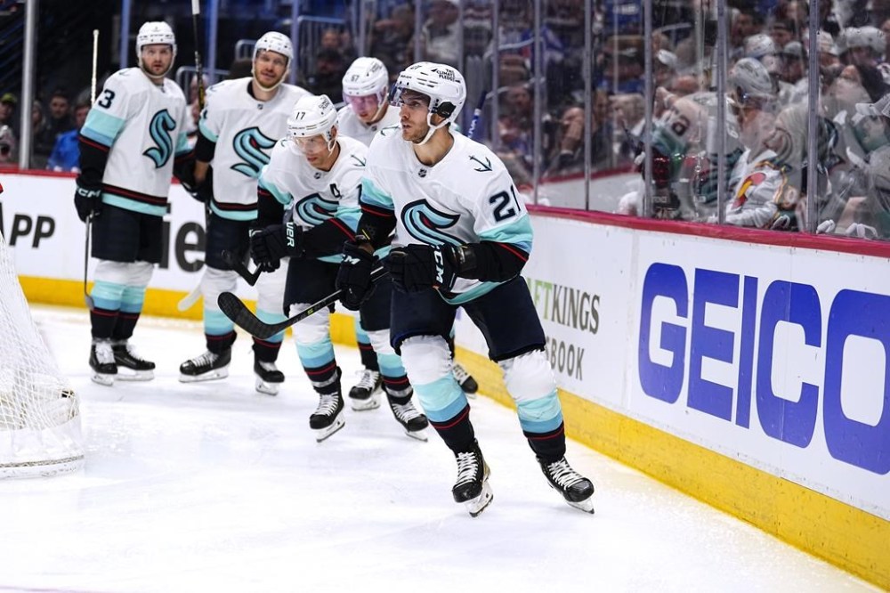 Seattle Kraken center Alex Wennberg (21) celebrates a goal against the Colorado Avalanche during the second period of Game 1 of a first-round NHL hockey playoff series Tuesday, April 18, 2023, in Denver. (AP Photo/Jack Dempsey)
