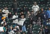 Fans vie for the solo home run ball hit by Milwaukee Brewers' Willy Adames against the Seattle Mariners during the sixth inning of a baseball game Tuesday, April 18, 2023, in Seattle. (AP Photo/Lindsey Wasson)