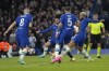 Real Madrid's Rodrygo, third from right, scores the opening goal during the Champions League quarterfinal second leg soccer match between Chelsea and Real Madrid at Stamford Bridge stadium in London, Tuesday, April 18, 2023. (AP Photo/Kirsty Wigglesworth)