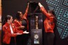 Former Canadian internationals, from left to right, Diana Matheson, Robyn Gayle and Jonelle Filigno unveil the FIFA Women’s World Cup trophy, in Toronto, Wednesday, April 19, 2023, as part of its worldwide tour in advance of this summer's tournament in Australia and New Zealand. THE CANADIAN PRESS/Neil Davidson