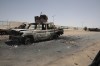 Destroyed military vehicles are seen in southern in Khartoum, Sudan, Thursday, April 20, 2023. The latest attempt at a cease-fire between the rival Sudanese forces faltered as gunfire rattled the capital of Khartoum. Through the night and into Thursday morning, gunfire could be heard almost constantly across Khartoum. (AP Photo/Marwan Ali)