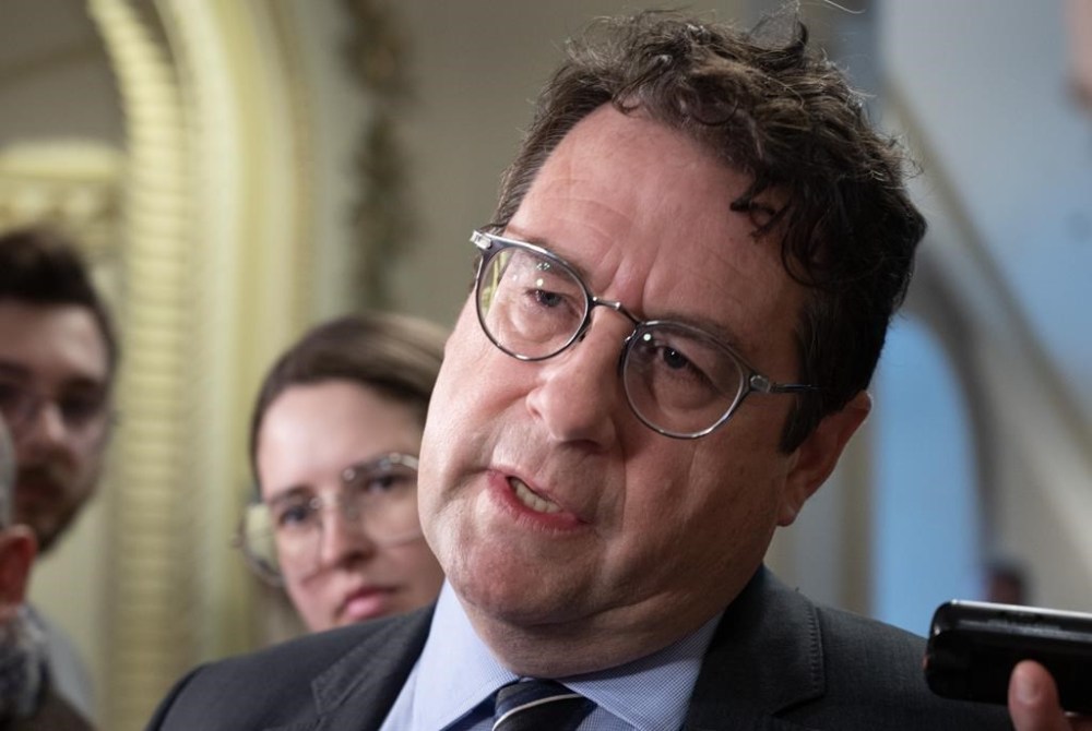 Quebec Education Minister Bernard Drainville responds to reporters' questions, Thursday, April 20, 2023, at the legislature in Quebec City. THE CANADIAN PRESS/Jacques Boissinot
