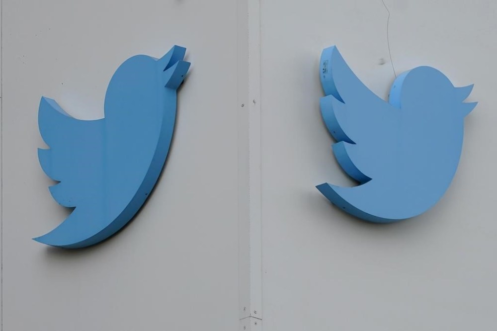 Twitter logos hang outside the company's offices in San Francisco, Monday, Dec. 19, 2022. A global journalism organization is calling on Twitter to correct its description of public broadcasters in Canada, Australia, New Zealand and South Korean. THE CANADIAN PRESS/AP-Jeff Chiu