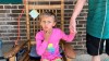 Kinsley White, 6, shows reporters a wound left on her face, Thursday, April 20, 2023 in Gastonia, N.C. A North Carolina man shot and wounded a 6-year-old girl and her parents after children went to retrieve a basketball that had rolled into his yard, according to neighbors and the girl's family — another in a string of recent shootings sparked by seemingly trivial reasons. (Kara Fohner/The Gaston Gazette via AP)