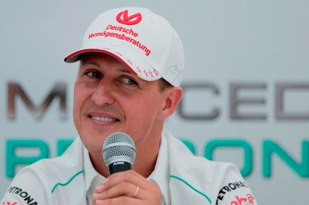 FILE - Michael Schumacher announces his retirement from Formula One during a press conference at the Suzuka Circuit venue for the Japanese Formula One Grand Prix in Suzuka, Japan, Oct. 4, 2012. The family of Formula One great Michael Schumacher plans to take legal action against a German magazine for publishing what it claimed to be an artificial intelligence-generated interview with Schumacher. Family spokesperson Sabine Kehm confirmed to The Associated Press by email on Thursday, April 20, 2023, that legal action is being planned over a “fake artificial intelligence interview by German outlet Die Aktuelle.