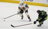Vegas Golden Knights defenceman Zach Whitecloud (2) skates with the puck as Dallas Stars center Luke Glendening (11) moves in during the first period of an NHL hockey game in Dallas, Saturday, April 8, 2023. Members from Sioux Valley Dakota Nation in southwestern Manitoba donned Vegas Golden Knights jerseys as they watched the team battle the Winnipeg Jets during the series-opener Tuesday evening with all eyes on Whitecloud. THE CANADIAN PRESS/AP-LM Otero