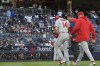 Los Angeles Angels' Logan O'Hoppe (14) walks off the field after being injured during the ninth inning of the team's baseball game against the New York Yankees, Thursday, April 20, 2023, in New York. The Yankees won 9-3. (AP Photo/Mary Altaffer)