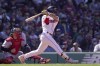 Boston Red Sox's Jarren Duran hits a two-run double in front of Minnesota Twins' Christian Vazquez, left, in the third inning of a baseball game, Thursday, April 20, 2023, in Boston. (AP Photo/Steven Senne)