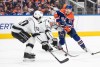 Los Angeles Kings' Sean Durzi (50) and Arthur Kaliyev (34) try to stop Edmonton Oilers' Connor McDavid (97) during second period NHL Stanley Cup first round playoff action in Edmonton on Wednesday April 19, 2023. THE CANADIAN PRESS/Jason Franson