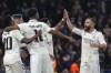 Real Madrid's Rodrygo, second from right, celebrates with teammates after scoring his side's second goal during the Champions League quarterfinal second leg soccer match between Chelsea and Real Madrid at Stamford Bridge stadium in London, Tuesday, April 18, 2023. (AP Photo/Kirsty Wigglesworth)