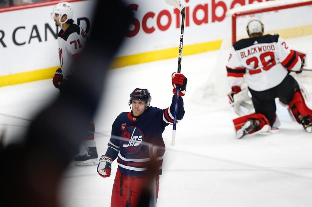 Winnipeg Jets' Nikolaj Ehlers (27) celebrates his goal on New Jersey Devils goaltender Mackenzie Blackwood (29) during third period NHL action in Winnipeg, Sunday, April 2, 2023. Jets coach Rick Bowness says he's hopeful that Ehlers will soon get medical clearance to return to the lineup for their first-round playoff series against the Vegas Golden Knights.THE CANADIAN PRESS/John Woods