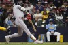 Boston Red Sox's Jarren Duran hits an RBI single during the sixth inning of a baseball game against the Milwaukee Brewers Friday, April 21, 2023, in Milwaukee. (AP Photo/Aaron Gash)