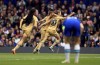 Barcelona's Caroline Graham Hansen, centre right celebrates with teammates after scoring the opening goal during the Women's Champions League semi-final first leg soccer match between Chelsea and Barcelona, at Stamford Bridge, London, Saturday April 22, 2023. (Bradley Collyer/PA via AP)