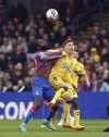 Crystal Palace's Odsonne Edouard, left and Everton's James Garner viefor the ball, during the English Premier League soccer match between Crystal Palace and Everton, at Selhurst Park, London, Saturday April 22, 2023. (Gareth Fuller/PA via AP)