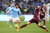 Lazio's Felipe Anderson, left, challenges for the ball with Torino's Alessandro Buongiorno during the Italian Serie A soccer match between Lazio and Torino at the Stadio Olimpico stadium in Rome, Italy, Saturday, April 22, 2023. (AP Photo/Alessandra Tarantino)