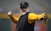 Pittsburgh Pirates manager Derek Shelton throws before a baseball game against the Colorado Rockies, Monday, April 17, 2023, in Denver. (AP Photo/David Zalubowski)
