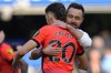Brighton's head coach Roberto De Zerbi, right hugs the winning goal scorer Julio Enciso at the end of the English Premier League soccer match between Chelsea and Brighton and Hove Albion at Stamford Bridge stadium in London, Saturday, April 15, 2023. (AP Photo/Kirsty Wigglesworth)