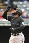 Miami Marlins' Bryan De La Cruz celebrates hitting a solo home run off Cleveland Guardians starting pitcher Shane Bieber during the sixth inning in the first baseball game of a doubleheader, Saturday, April 22, 2023, in Cleveland. (AP Photo/Nick Cammett)