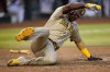 San Diego Padres' Juan Soto scores on a two RBI single hit by Ha-Seong Kim during the sixth inning of a baseball game against the Arizona Diamondbacks, Saturday, April 22, 2023, in Phoenix. (AP Photo/Matt York)