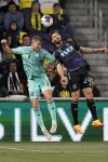Nashville SC defender Josh Bauer (22) and Los Angeles FC midfielder Ryan Hollingshead (24) battle for the ball during the second half of an MLS soccer match Saturday, April 22, 2023 in Nashville, Tenn. Nashville SC and Los Angeles FC played to a 1-1 draw. (AP Photo/George Walker IV)