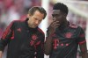 Bayern's Alphonso Davies leaves the pitch after an injury during the German Bundesliga soccer match between 1. FSV Mainz 05 and FC Bayern Munich at the Mewa Arena in Mainz, Germany, Saturday, April 22, 2023. (AP Photo/Matthias Schrader)