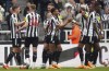 Newcastle United's Jacob Murphy, center, celebrates scoring their side's third goal of the game during the English Premier League soccer match between Newcastle United and Tottenham at St. James' Park, Newcastle upon Tyne, England, Sunday, April 23, 2023. (Owen Humphreys/PA via AP)
