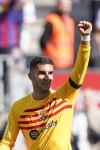 Barcelona's Ferran Torres celebrates after scoring his side's opening goal during a Spanish La Liga soccer match between Barcelona and Atletico Madrid, at the Camp Nou stadium in Barcelona, Spain, Sunday, April 23, 2023. (AP Photo/Joan Mateu)