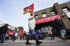 PSAC workers and supporters picket in front of President of the Treasury Board Mona Fortier's office in Ottawa on Friday, April 21, 2023. One of Canada's largest labour disruptions has entered a sixth day, as the union representing thousands of striking public-service workers looks to delay access to ports. THE CANADIAN PRESS/Sean Kilpatrick